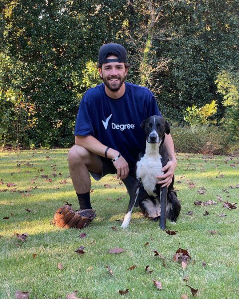 Darby Swanson poses a picture with his beloved dog.